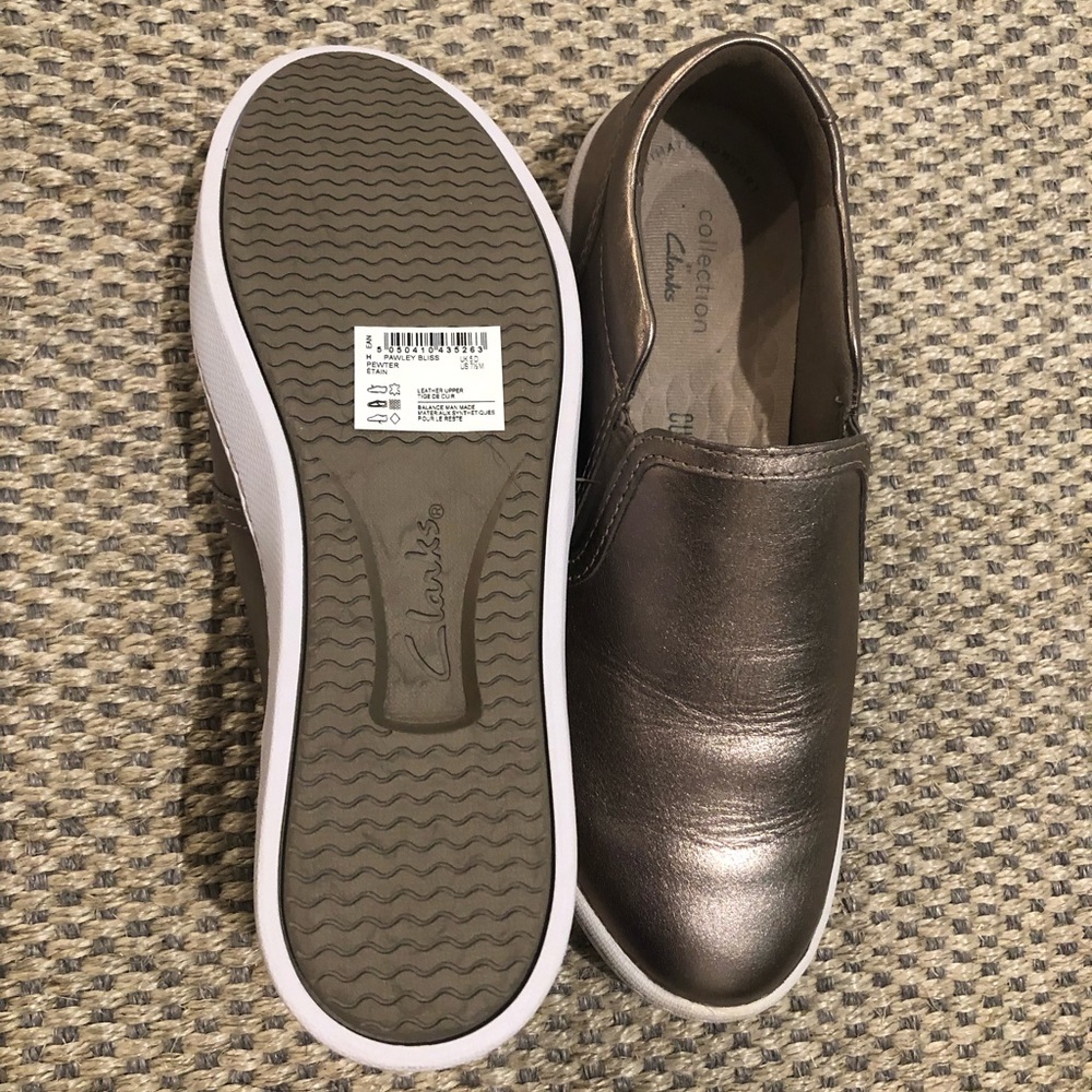 Metallic gold Clark’s slide on sneakers